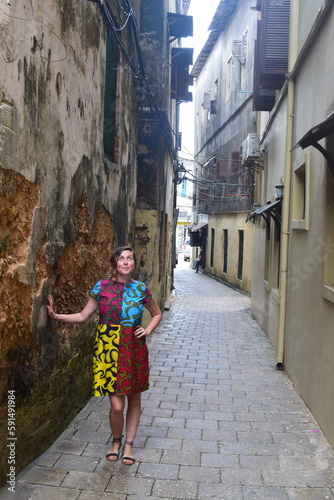 Girl poses in ancient Stone Town, Zanzibar street