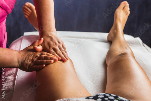 Details of the hands of a masseuse during an anti-cellulite massage