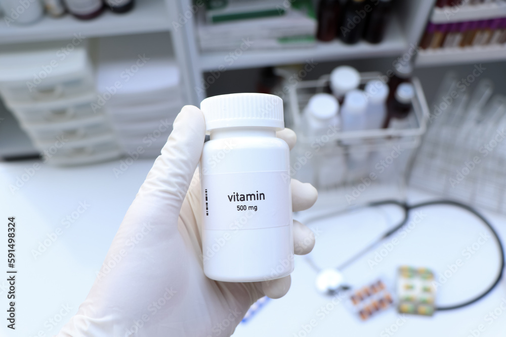 vitamin pill in white bottle, pill stock