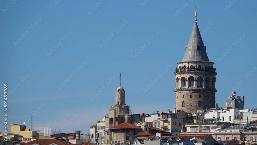 Istanbul city skyline in Turkey, Beyoglu district old houses with Galata tower on top, view from the Golden Horn in Eminönü side.
