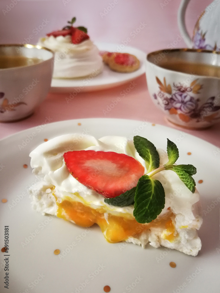Delicious Pavlova cake dessert with fresh strawberry. Piece of dessert