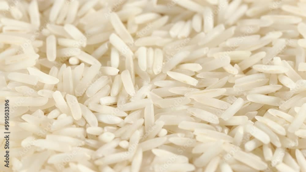 traveling dolly shot closeup of a heap of raw basmati rice traveling dolly shot closeup of a heap of raw basmati rice