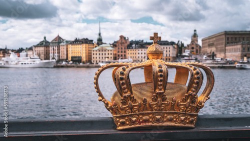 Golden crown symbol with Stockholm city in the background, Sweden