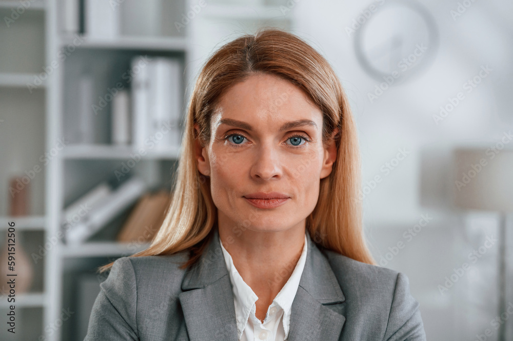 Portrait of woman in business formal clothes that is in the office Portrait of woman in business formal clothes that is in the office