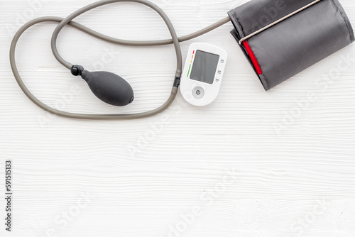 Medical device tonometer for blood pressure and heart rate on white background.