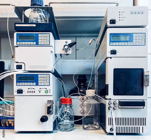 An HPLC (high-performance liquid chromatography) setup; including a pumping device generating a gradient of two different solvents, an autosampler, and a detector for measuring the absorbance.