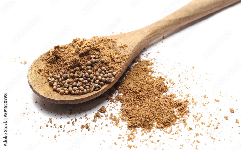 Coriander powder pile in wooden spoon isolated on white Coriander powder pile in wooden spoon isolated on white