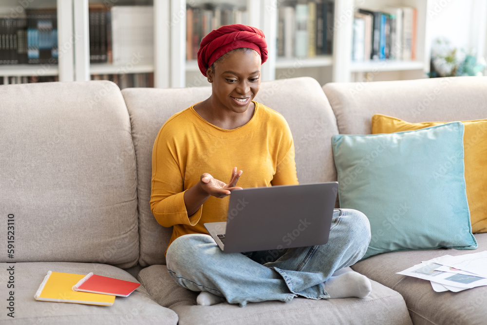 Young black woman employee have video call with colleagues Young black woman employee have video call with colleagues