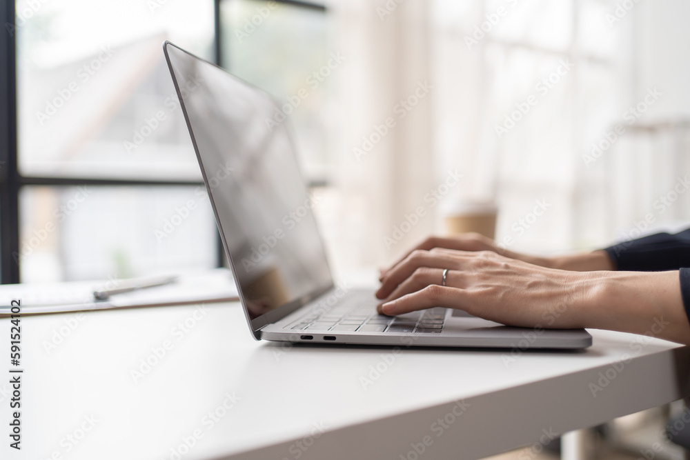Typing out some new ideas. Cropped shot of a young businesswoman working on a laptop.