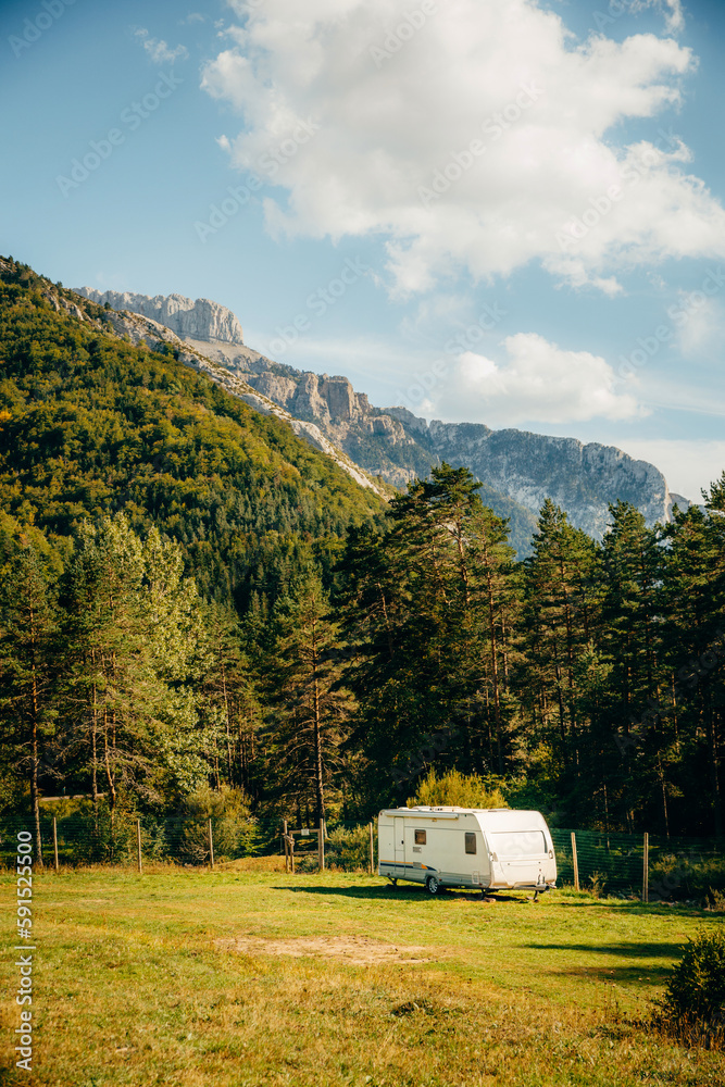 Caravan with amazing landscape views of forest and mountains. Camping holiday and outdoor summer vacation. Nomad lifestyle concept Caravan with amazing landscape views of forest and mountains. Camping holiday and outdoor summer vacation. Nomad lifestyle concept