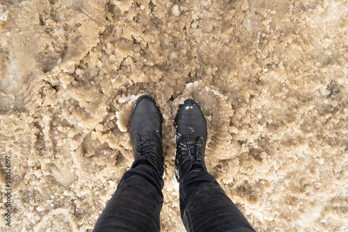 Winter Boots in Wet Dirty Snow, Warm Winter Shoes, Waterproof Surface, Hiking Footwear, Black Winter Boots