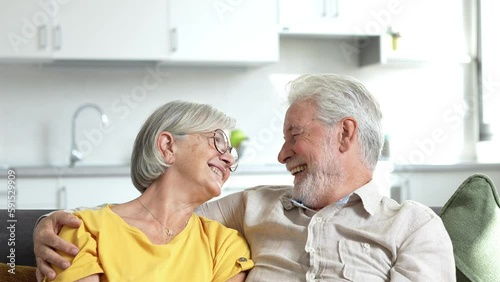Happy mature couple in love embracing, laughing grey haired husband and wife with closed eyes, horizontal banner, middle aged smiling family enjoying tender moment, happy marriage, sincere feelings
