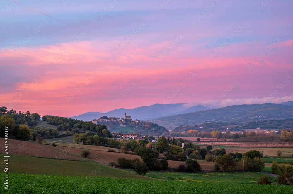 Beautiful authentic Italian Landscape at pink sunset in Tuscany with colourful sky. Tuscany, Italy in autumn.