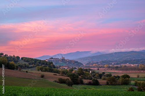Beautiful authentic Italian Landscape at pink sunset in Tuscany with colourful sky. Tuscany, Italy in autumn.