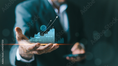 planning and strategy, Stock market, Business growth, progress or success concept. Businessman or trader is showing a growing virtual hologram stock, invest in trading.