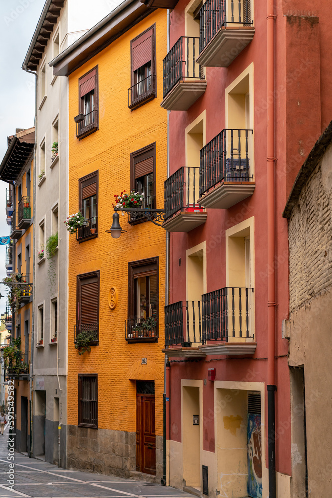 Pamplona, Navarra, SPAIN. The beautiful streets of the city of Pamplona. Beautifully coloured buildings with flowers of different colours, hanging from the balconies. Famous travel destination