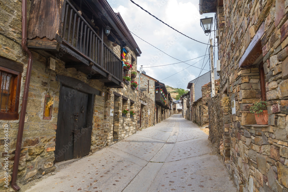 Main Street El Acebo on the Camino de Santiago in the province of Leon in Spain, with buildings of stone and wooden balconies