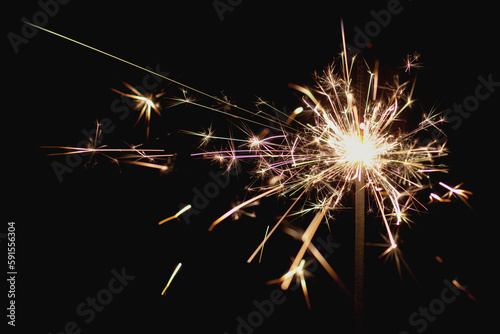 Closeup sparkler emitting sparks photo