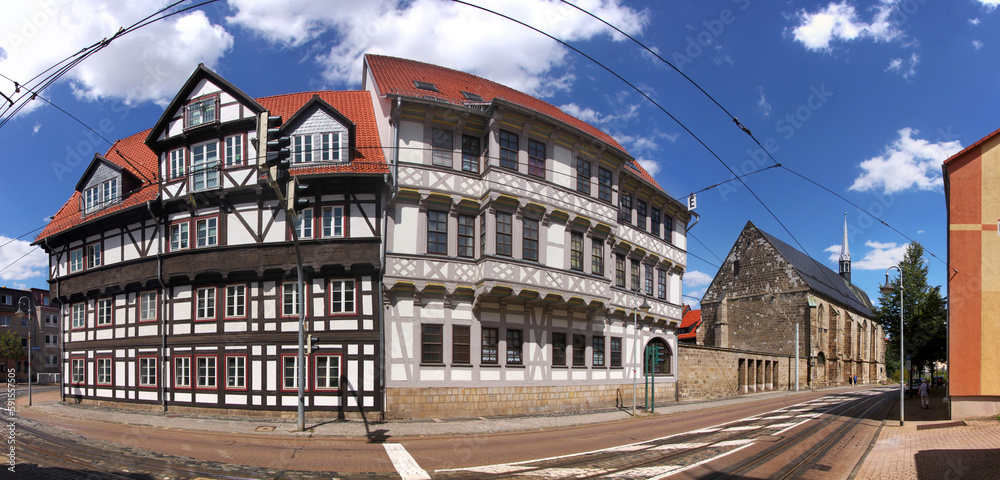 Panoramic view of traditional half-timbered houses and St. Katharinen church at Dominikanerstraße street in the old town of Halberstadt, Germany