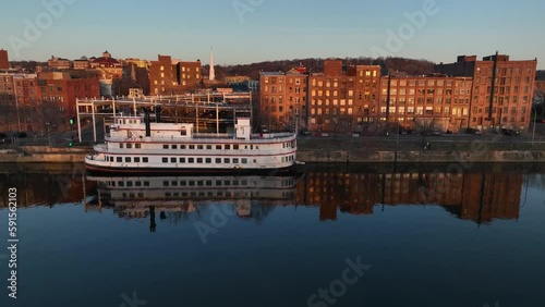 Aerial view of downtown Troy, New York at sundown from above the Hudson River