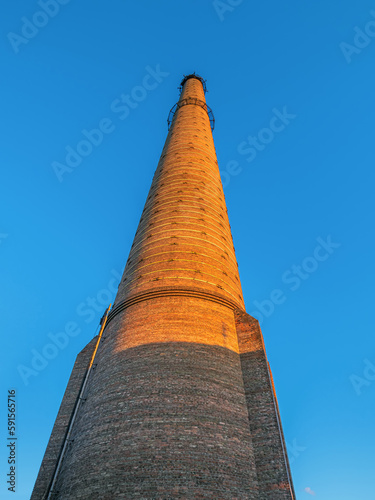 300th ft. brick smokestack chimney on the old boiler house photo