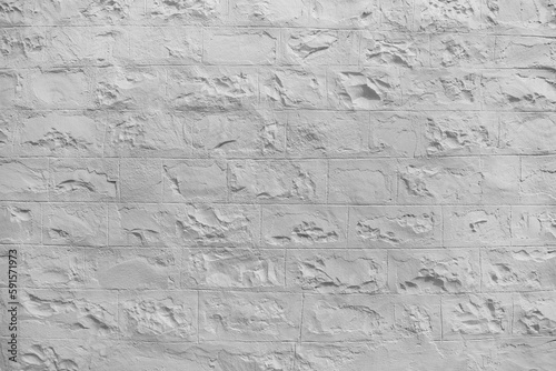 White painted rough stone wall texture.