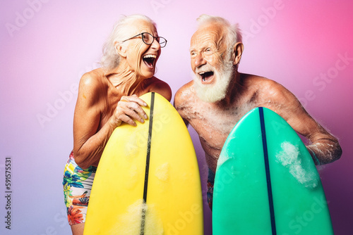 Old couple of husband and wife, enjoying retirement - they are having fun surfing. Generative AI