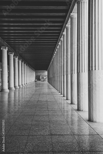Black and white photo of Stoa of Attalos (covered walkway or portico) in the Agora of Athens, Greece. The current building was reconstructed by the american school