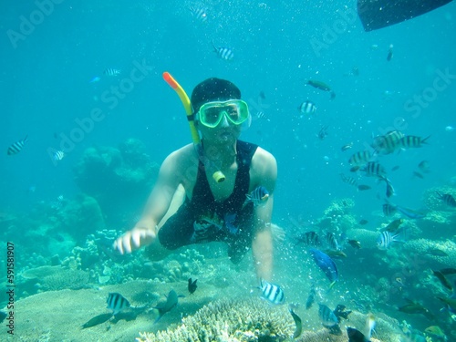 person snorkeling in a lagoon