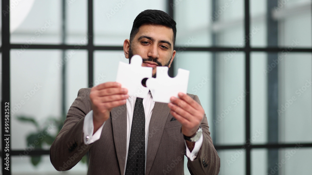 businessman show white jigsaw in hand, business strategy concept businessman show white jigsaw in hand, business strategy concept