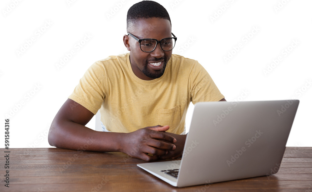 Smiling man looking into laptop at table Smiling man looking into laptop at table