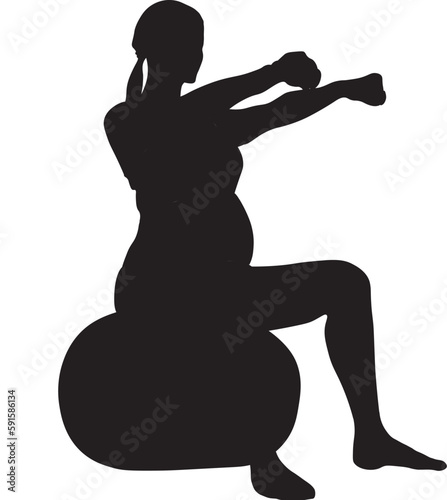 silhouette of a woman pregnant doing yoga