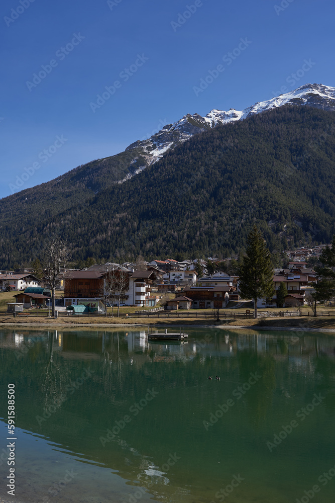 Kampl, Austria - March 16, 2023 - the Lake Kampler in an alpine valley Stubaital at the end of the winter season
