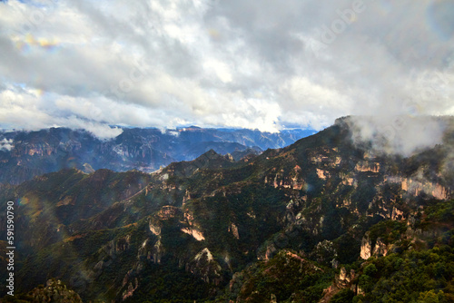 mountains in winter with cloudy sky , copper canyon with clouds of rain in divisadero, chihuahua mexico 