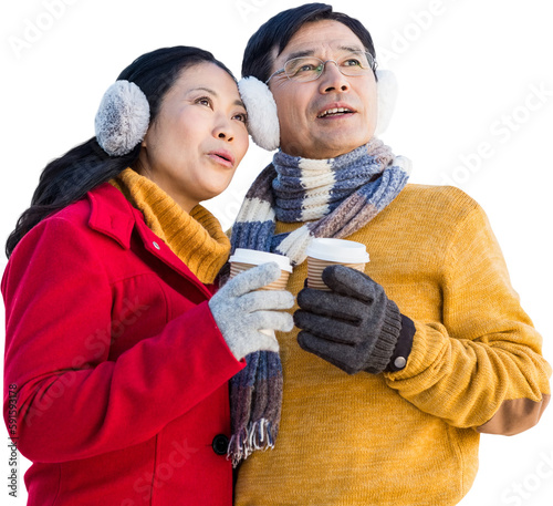 Older asian couple with coffee to go