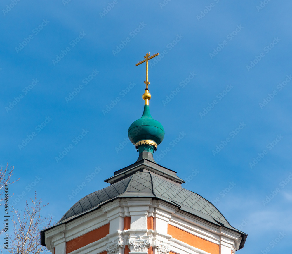golden cross on a church