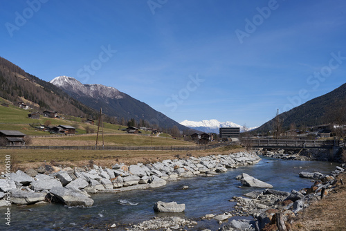 Kampl, Austria - March 16, 2023 - modification of the Ruetz riverbed in an alpine valley Stubaital at the end of the winter season photo