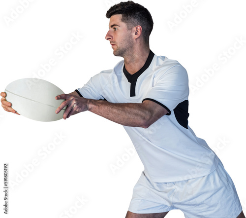 Rugby player leaning over while holding the ball