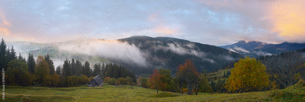 Misty early daybreak in autumn Carpathian mountain, Ukraine.