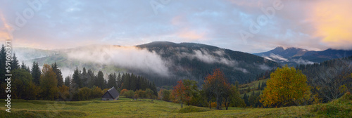 Misty early daybreak in autumn Carpathian mountain, Ukraine.