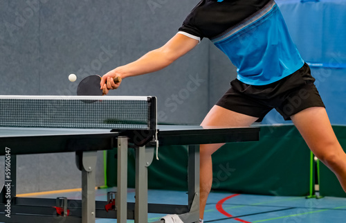 close up of table tennis player returning the ball