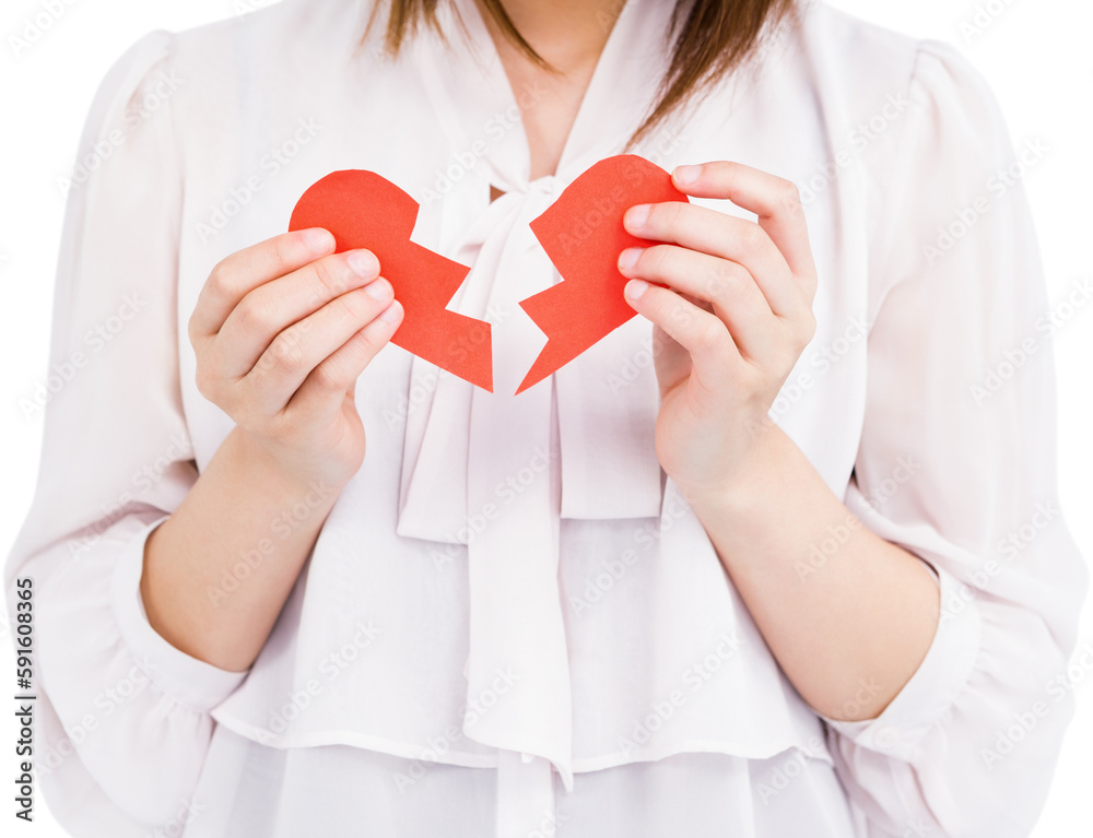 Woman holding broken heart paper