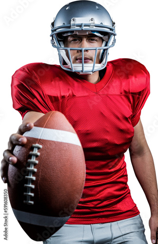 Portrait of determined American football player showing ball