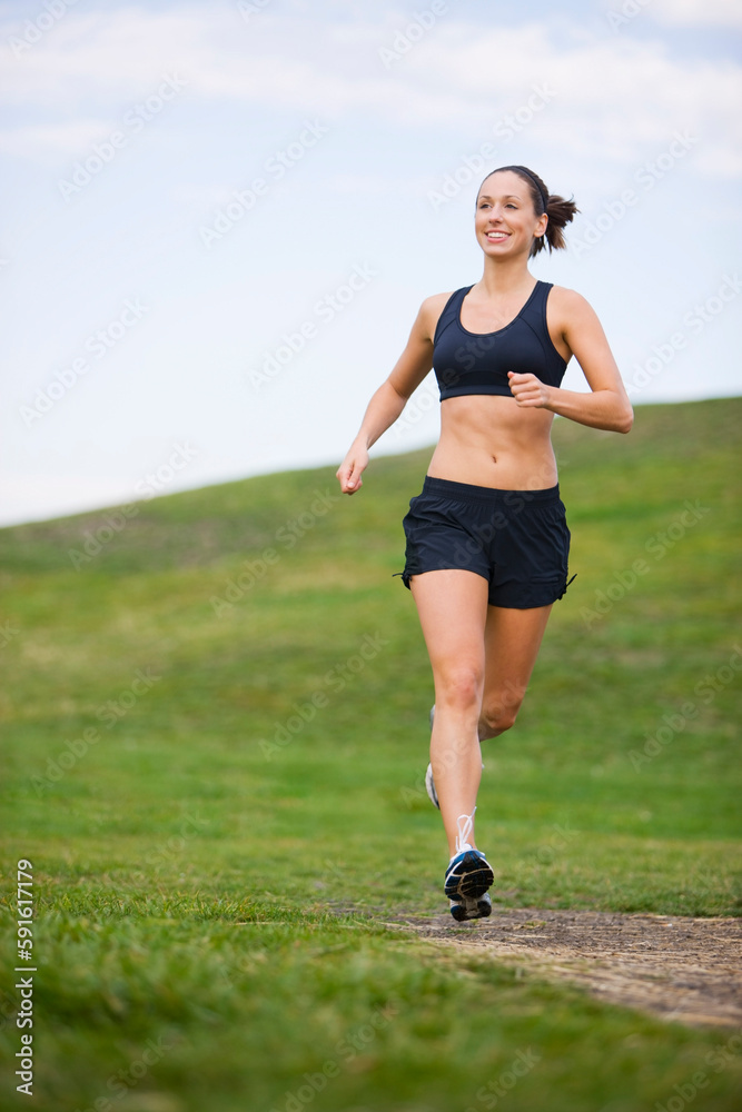Woman Running in Park, Seattle, Washington, USA Woman Running in Park, Seattle, Washington, USA