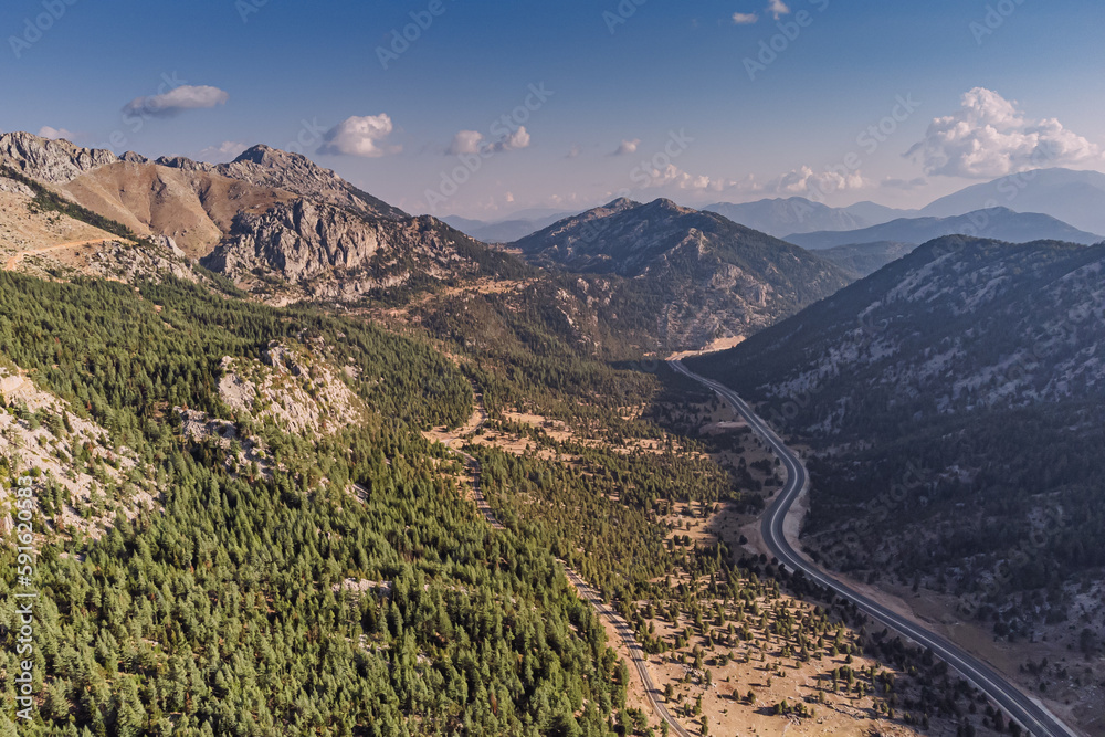 The aerial view of the scenic mountain road in Turkey is truly majestic, as it offers a breathtaking panorama of the surrounding landscape.