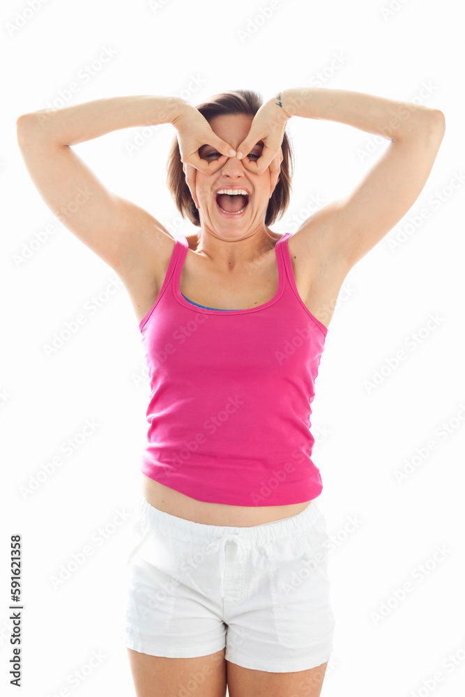 Portrait of Young Woman wearing Tank Top and Shorts making Mask with Fingers in Studio Portrait of Young Woman wearing Tank Top and Shorts making Mask with Fingers in Studio