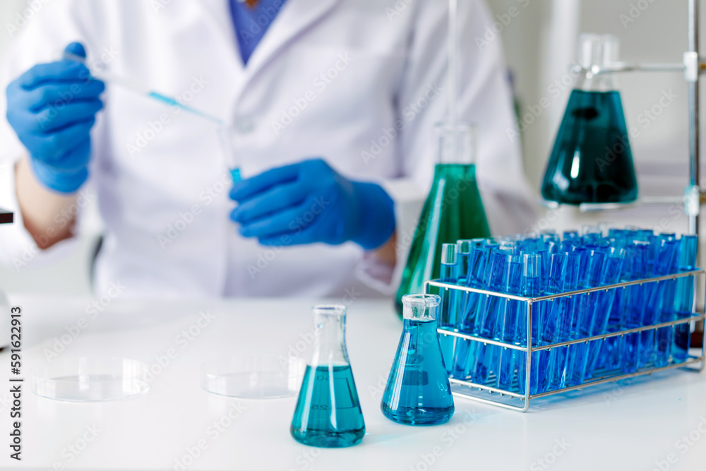 biochemical research scientist team working with microscope for coronavirus vaccine development in pharmaceutical research labolatory, selective focus biochemical research scientist team working with microscope for coronavirus vaccine development in pharmaceutical research labolatory, selective focus