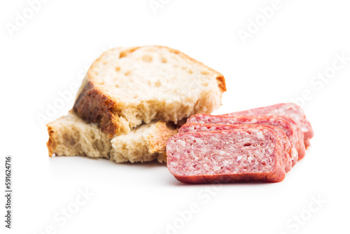 Smoked sausage. Sliced salami and bread isolatd on white background.