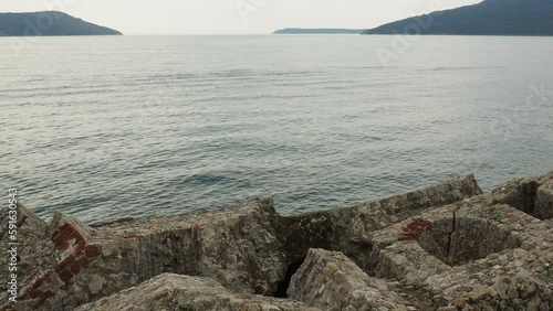 Fort Mezaluna Mesaluna Citadel Citadela Montenegro Herceg Novi. The ruins of an ancient stone fortress, destroyed in an earthquake, fell into the Adriatic Sea, the Mediterranean. Tourist attractions photo