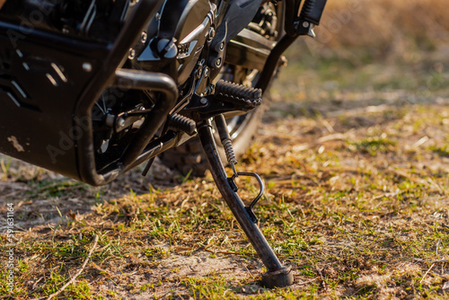 Motorcycle adventurer enduro footpeg extended and parked photo